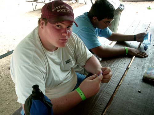 Matt working on his leatherwork merit badge.