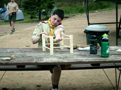 David making a a canoe seat, so he can earn his basketry merit badge.